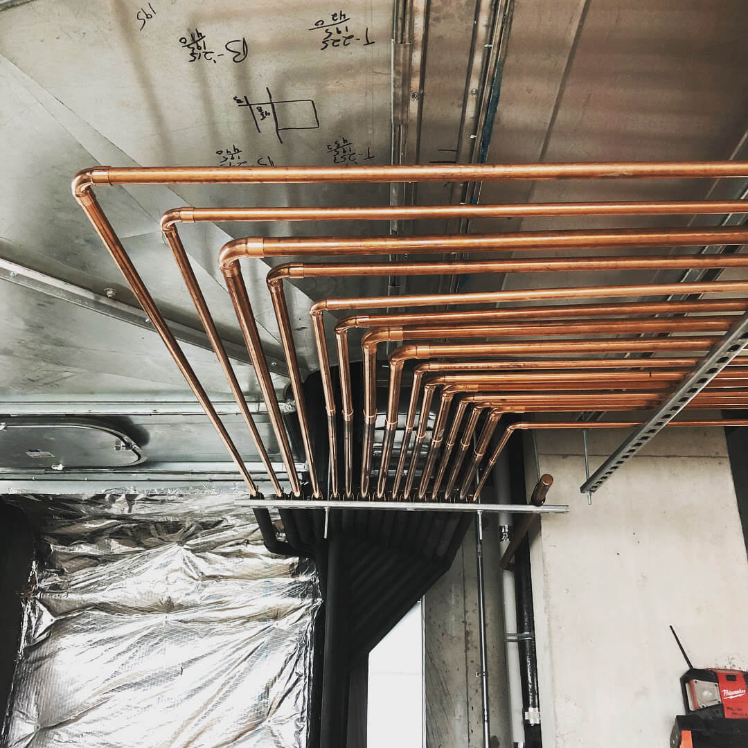 Pipes on ceiling of room